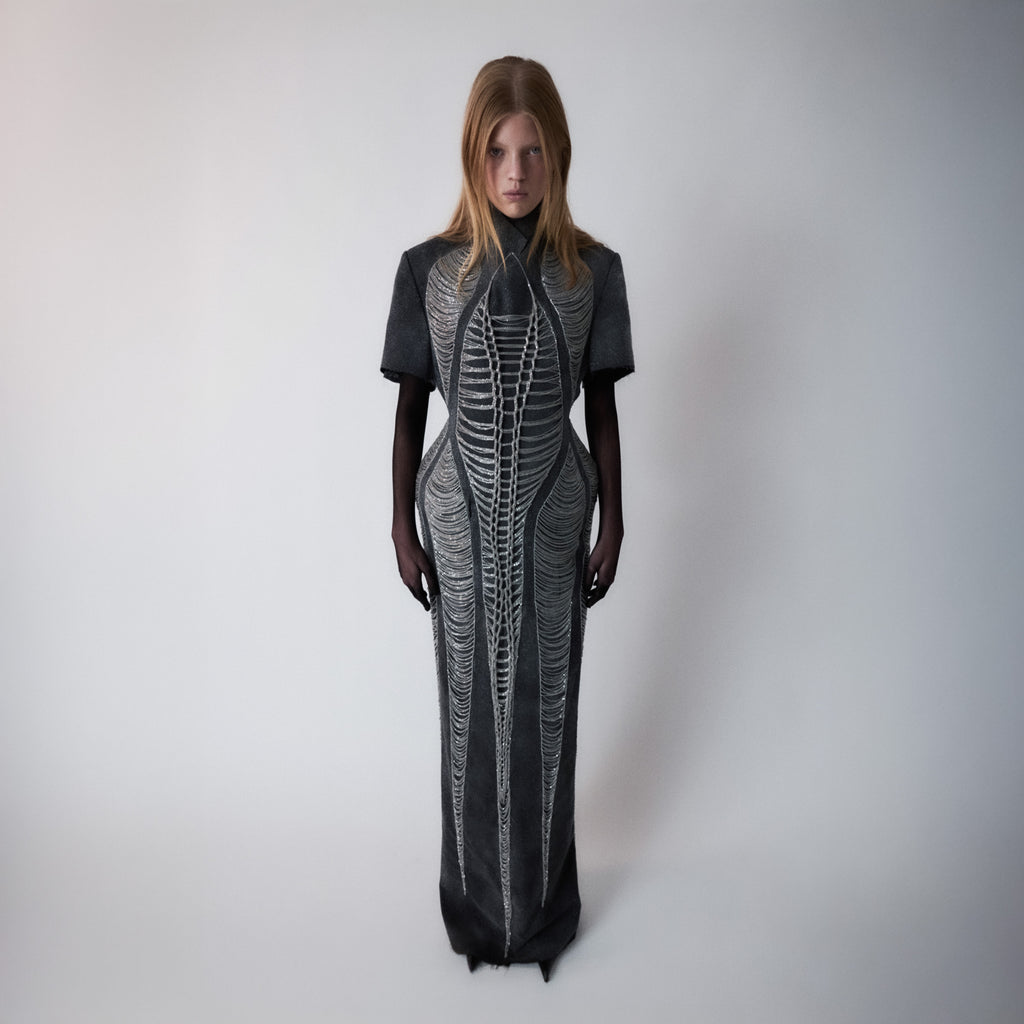 glittery gray long dress with chains details on light gray background 