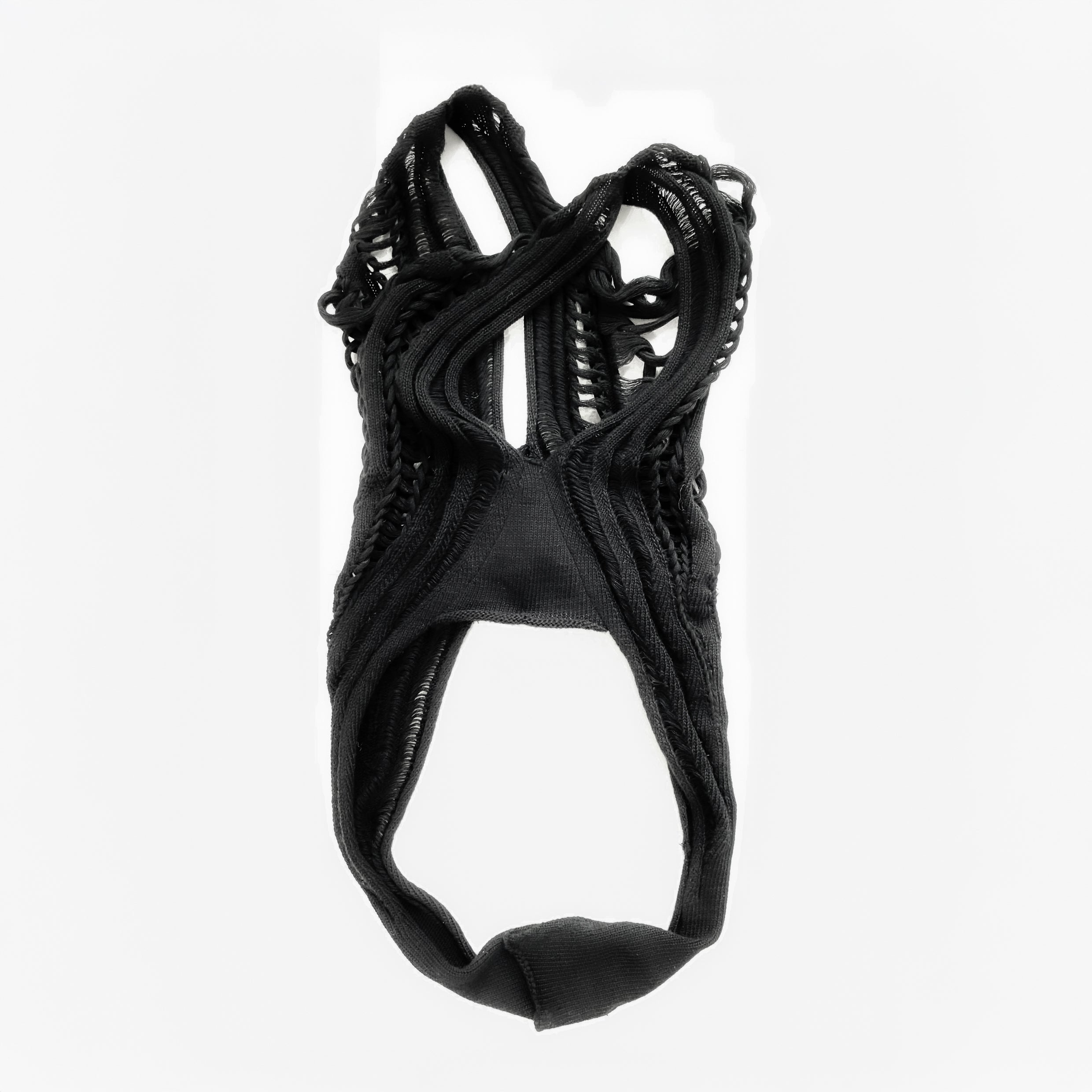 Black lace garment on a white background